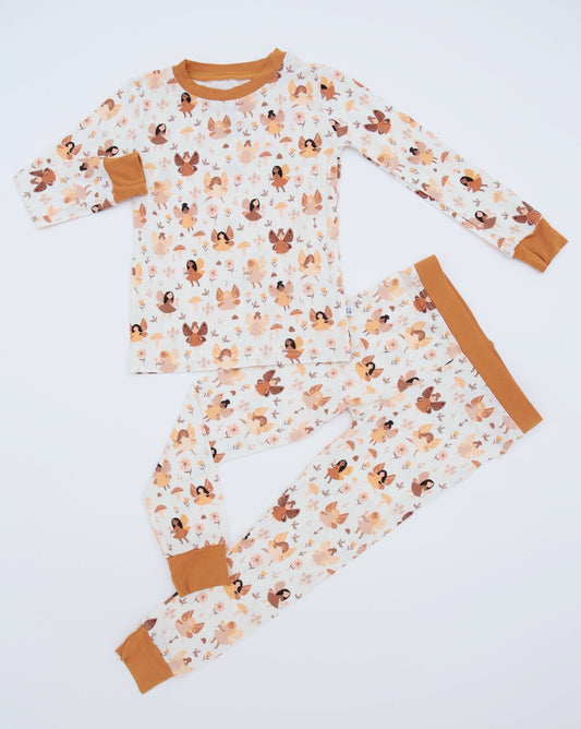 The Fairies • 2 Piece Bamboo Set (Classic Fit) features a long-sleeve design with a whimsical fairy print, crafted from ultra-soft bamboo fabric for all-night comfort and finished with matching cuffs for a cozy fit.