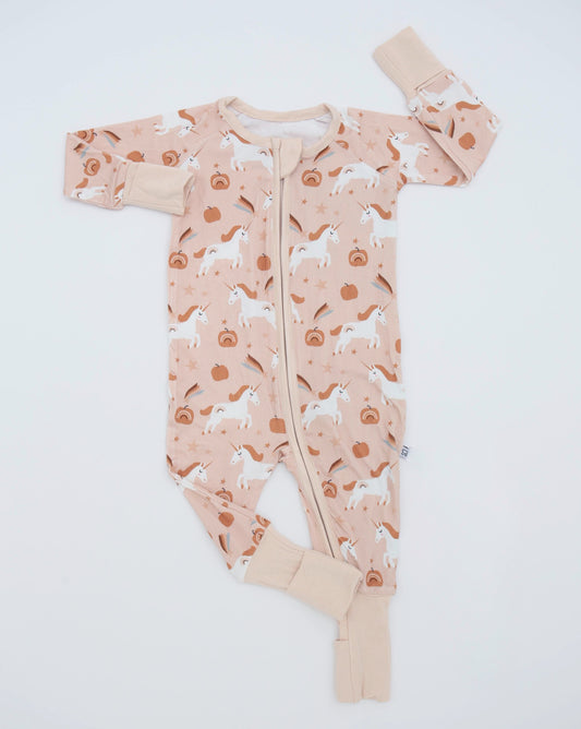 The Fall Unicorns • Bamboo Zippy (Classic Fit) is a peach-colored bamboo viscose baby onesie with white unicorns, pumpkins, autumn leaves, beige cuffs, and a YKK double zipper for easy changes.