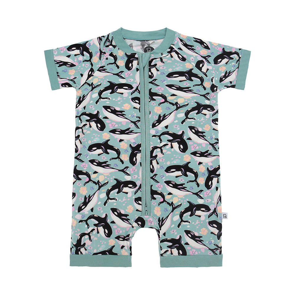 The Orca Love • Bamboo Shorty (Classic Fit) is a teal, short-sleeved baby romper with a front zipper, made from soft bamboo viscose and decorated with black and white orca whales swimming amid pastel sea plants and bubbles.