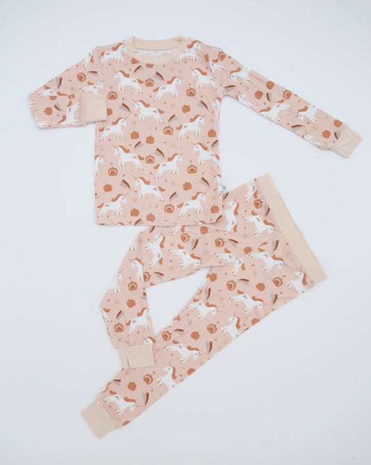The Fall Unicorns • 2 Piece Bamboo Set (Classic Fit) features a light pink background with white unicorns and orange pumpkins. Made from soft bamboo fabric, this cozy set includes a long-sleeved top and matching pants—great for sensitive skin.