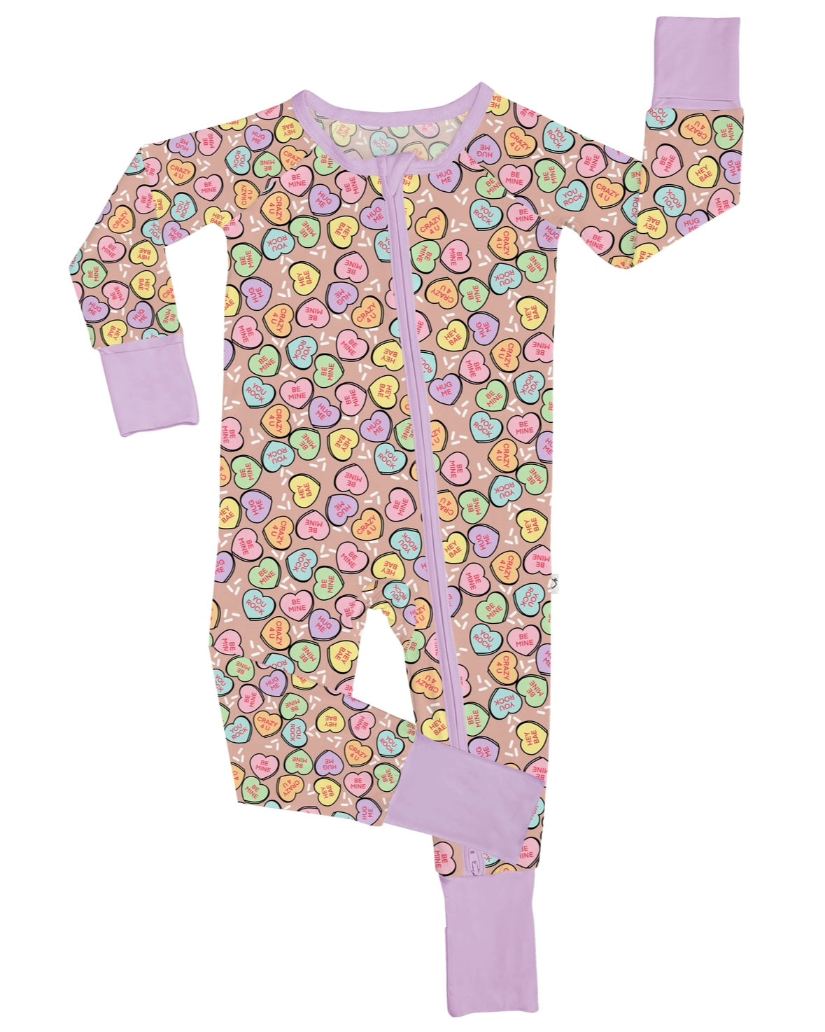 The Be Mine • Bamboo Zippy (Updated Fit) is a pink children’s onesie with a zipper front, gentle bamboo fabric for eczema-prone skin, solid lavender cuffs, and a colorful smiling fruit slice print. One sleeve and one leg are lifted upward.