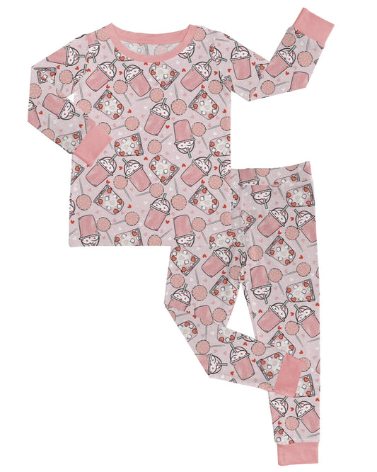 The Love You a Latte • 2 Piece Bamboo Set (Updated Fit) includes long sleeve top and pants in a stretchy, bamboo fabric with pink and white milk bottle, cookie, and cartoon face print plus solid pink cuffs—ideal for sensitive skin.