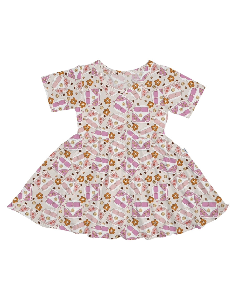 The Groovy Baby • Twirl Dress is a short-sleeved, knee-length dress with a flared skirt, adorned with pink and purple envelope, heart, and brown bear prints on white bamboo viscose—part of our cozy collection.