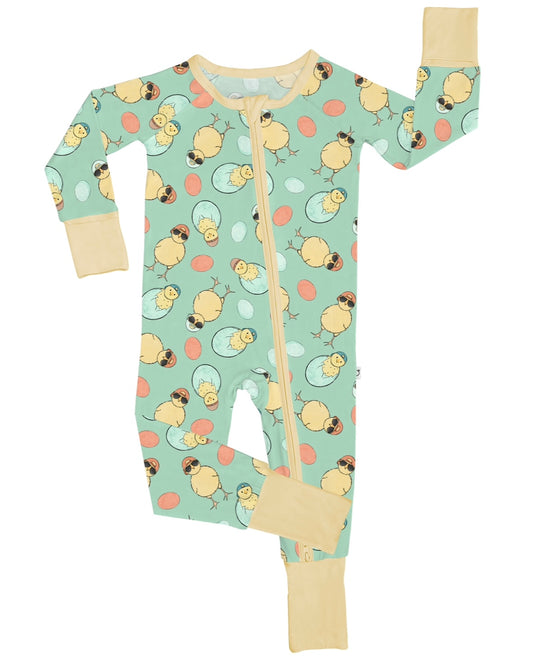 The Cool Chick • Bamboo Zippy (Updated Fit) is a mint green baby onesie with a zipper, decorated with yellow chicks, cracked eggs, and pastel dots. Made from soft bamboo fabric, it features light beige cuffs and collar.