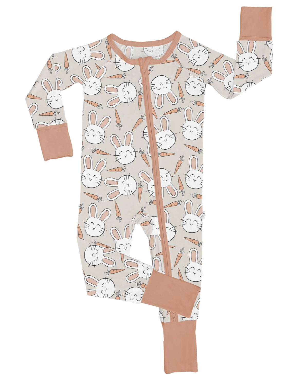 The Snuggle Bunny • Bamboo Zippy (Updated Fit) is a beige bamboo onesie with light brown cuffs and zipper, featuring white bunny faces and orange carrots. Made from soft bamboo viscose for ultimate comfort.