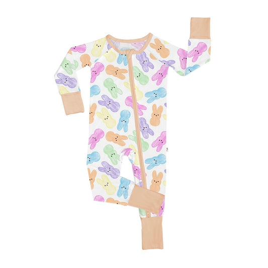 The Hoppy Dreams • Bamboo Zippy (Updated Fit) is made from soft bamboo viscose with pastel bunny prints and tan trim. Perfect for sensitive skin, it has a front zipper running from neck to leg for easy changes.