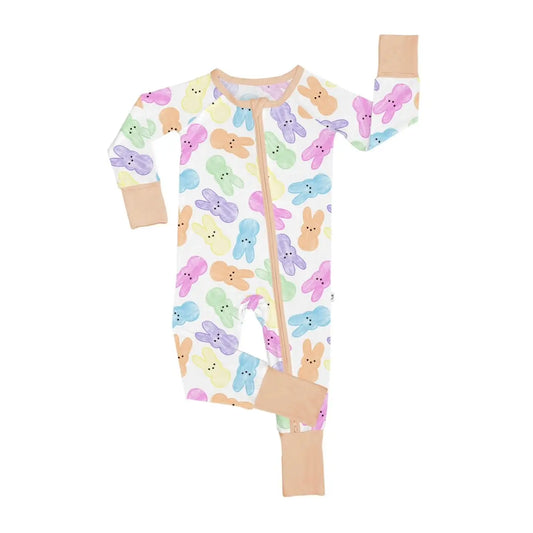 The Hoppy Dreams • Bamboo Zippy (Updated Fit) is made from soft bamboo viscose with pastel bunny prints and tan trim. Perfect for sensitive skin, it has a front zipper running from neck to leg for easy changes.