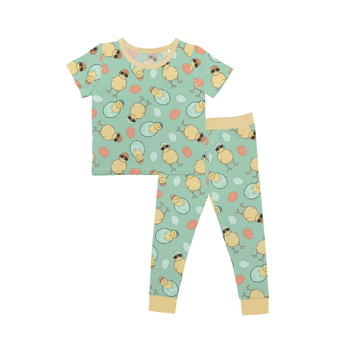The Cool Chick • 2 Piece Bamboo Set (Updated Fit) features a light green base with cute yellow chicks and eggs, plus a yellow-trimmed short-sleeve top and long pants—all crafted in soft bamboo for sensitive skin.