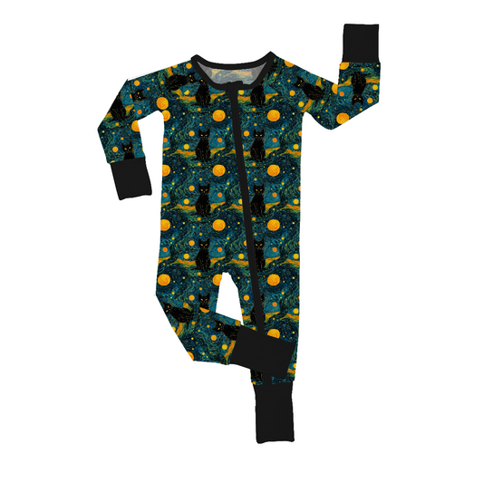 The Starry Cats • Bamboo Zippy (Updated Fit) is a soft bamboo baby onesie with a zipper, featuring black cats, yellow moons, and stars on dark blue, plus solid black cuffs and neckline for a snug fit. Part of our cozy collection.
