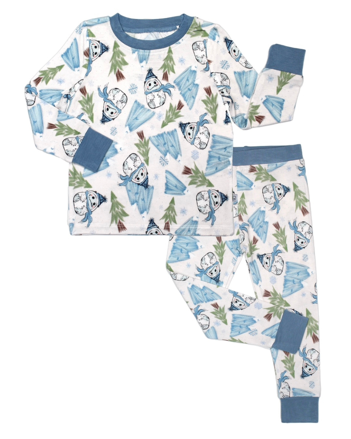 The Abominable Snowman • 2 Piece Bamboo Set (Updated Fit) is a cozy children’s pajama set with long sleeves and pants, featuring a winter theme with blue cuffs, icebergs, snowflakes, pine trees, and snowman faces in blue scarves and hats.