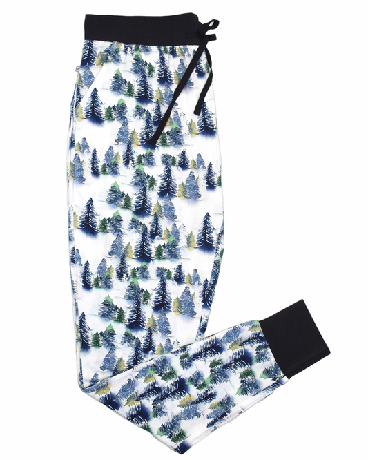 Snowy Trees • Womens Bamboo Pants feature gentle bamboo fabric, a white base with blue, green, and yellow watercolor trees, black cuffs, and a drawstring—ideal for eczema-prone skin.