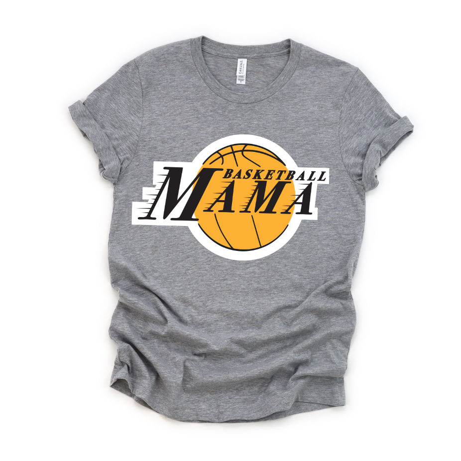 The Basketball Mama Tee is a gray unisex shirt with rolled sleeves, featuring “BASKETBALL MAMA” printed above a yellow basketball graphic.
