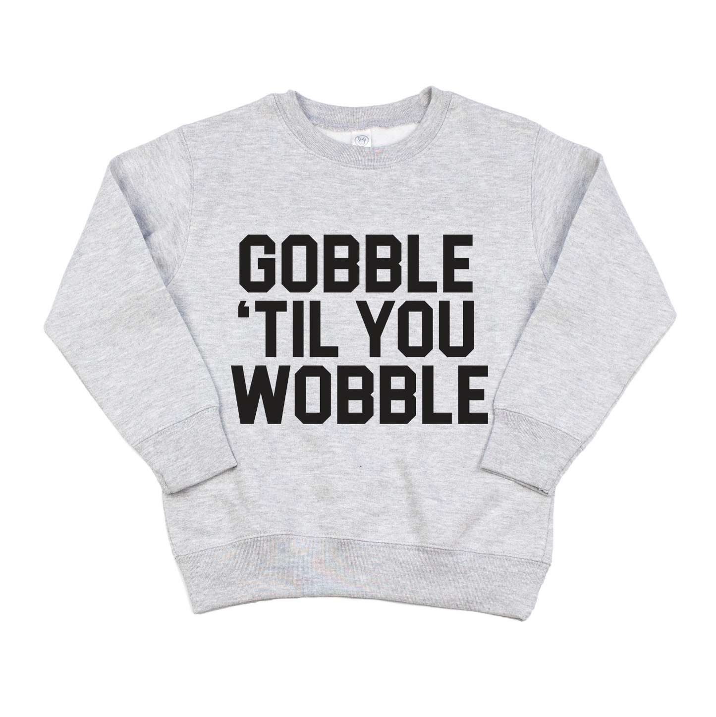The GOBBLE • Pullover is a light gray sweatshirt with bold black GOBBLE TIL YOU WOBBLE text on the front and an oversized fit for ultimate comfort.