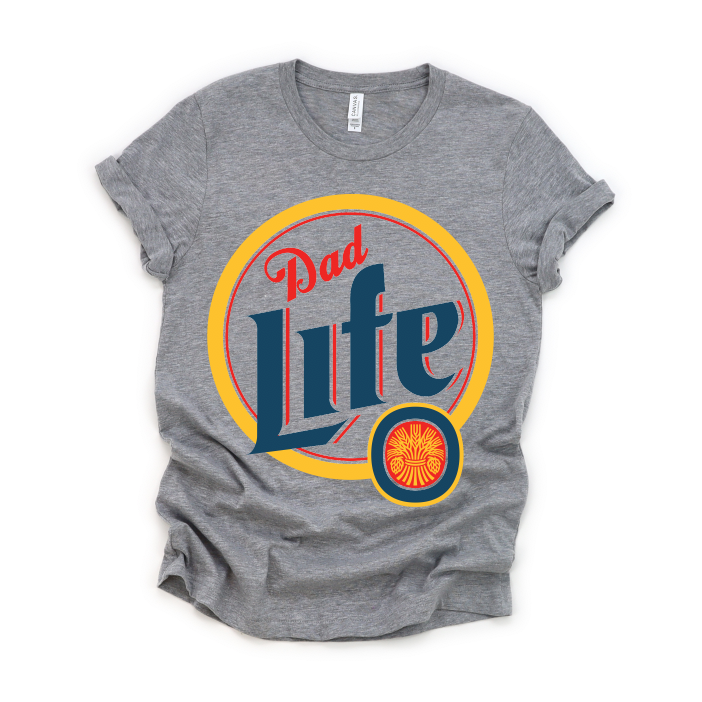 The Dad Life • Beer Tee is a heather gray unisex Tultex shirt featuring a retro Dad Life design in bold blue and red inside a yellow-red circle. Made from soft combed ring-spun cotton, it’s shown laid flat with rolled sleeves.