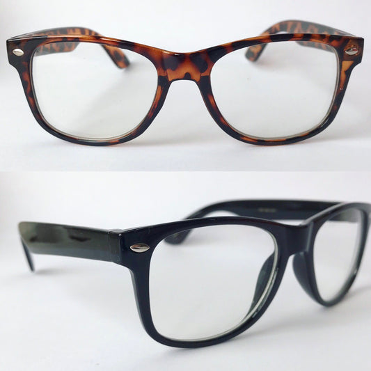 On a white background, two pairs of Nerd Glasses (kids) are displayed: the top pair with a brown tortoiseshell pattern and the bottom in classic black. Both feature clear lenses and similar rectangular frames.