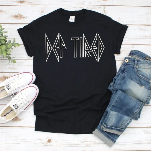 The Def Tired • Black Tee is a unisex Bella Canvas shirt in black, featuring Def Tired in a rock band-style font. Perfect for everyday comfort and style.