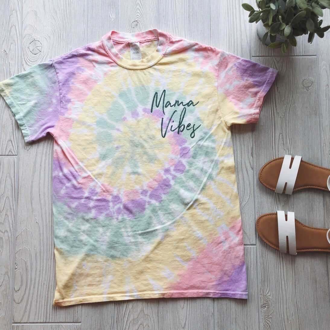 The Mama Vibes • Pastel Tie-Dye tee is a fun, effortless unisex shirt featuring “Mama Vibes” on the front—perfect for relaxed days and casual style.