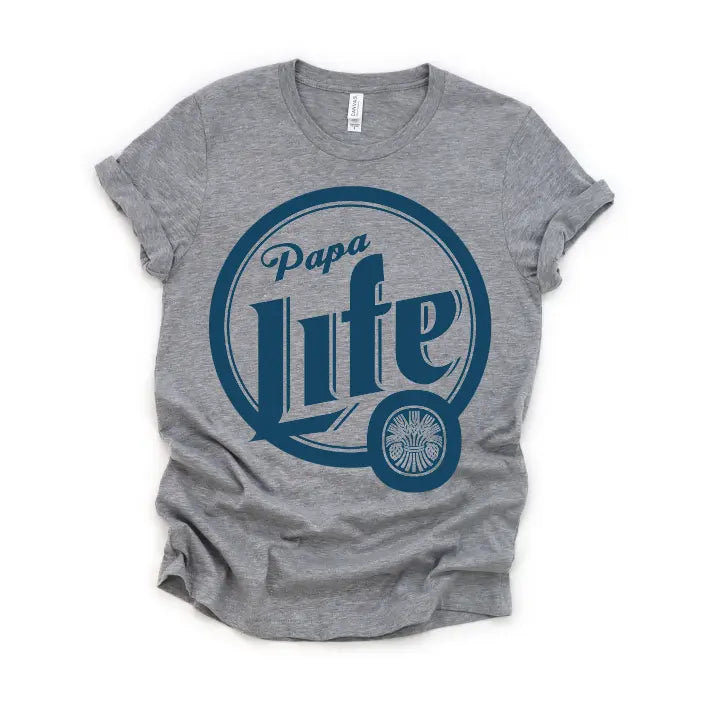 The Papa Life • Beer Tee is a gray unisex Tultex shirt with rolled sleeves, a bold blue circular Papa Life graphic on the front, and crafted from premium cotton for lasting comfort and style.