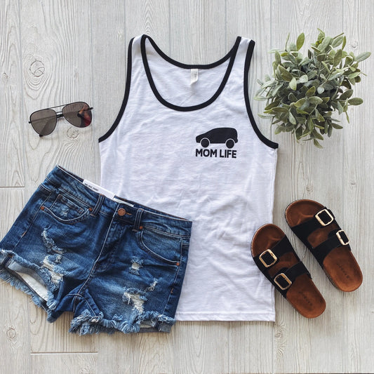 Flat lay of the Mini Vans • Ringer Tank with black trim and car graphic, styled with denim shorts, black sandals, sunglasses, and a small potted plant on a light wood surface.