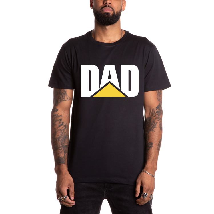 A man wears the DAD Workwear • Black Tee by Bella Canvas—unisex fit, “DAD” in bold white letters with a yellow triangle under the A, parody style—standing against a plain white background.