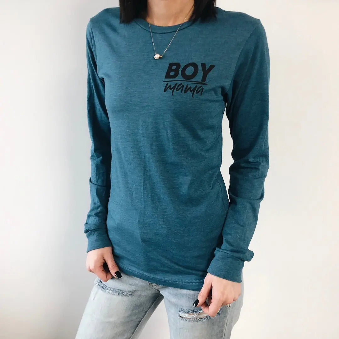 A person models the Boy Mama • Heather Teal Long Sleeve, featuring Boy Mama in black on the chest, paired with light ripped jeans and a necklace, set against a white background.