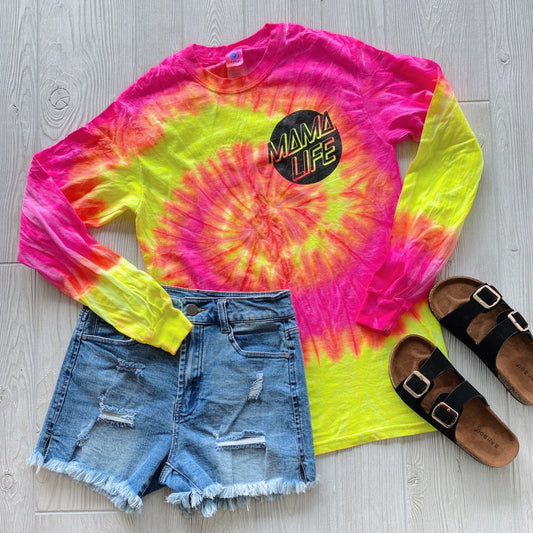 The Skater Mama • Fluorescent Long Sleeve, styled with distressed denim shorts and black buckle sandals on a light wood floor, makes the perfect casual outfit for days in Santa Cruz.