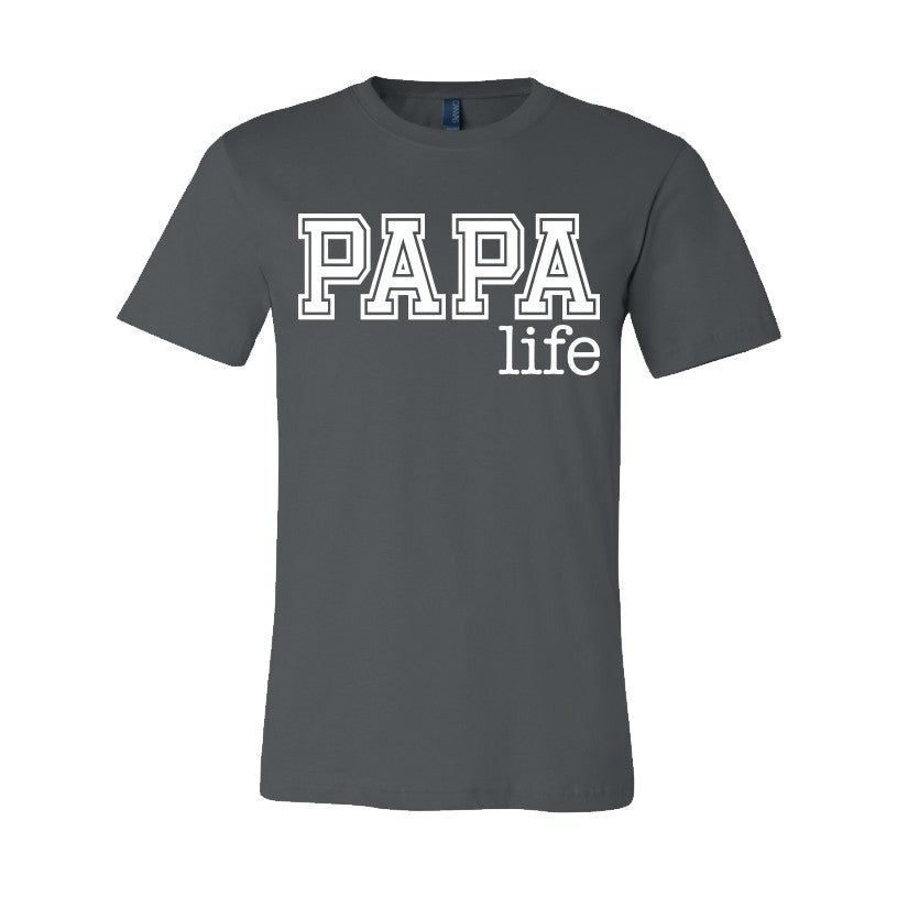 The Papa Life • Gray Tee is a dark gray unisex essential t-shirt, made in Michigan from soft combed and ring-spun cotton, featuring PAPA life in bold white letters across the chest.