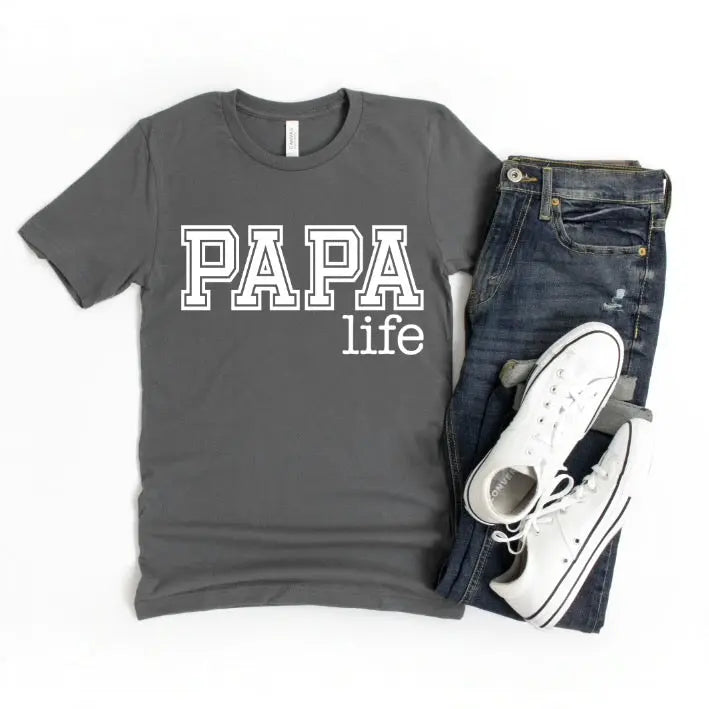 Papa Life • Gray Tee—a unisex essential made from combed and ring-spun cotton with “PAPA life” in bold white letters. Shown flat on a white surface styled with blue jeans and white sneakers for everyday comfort.